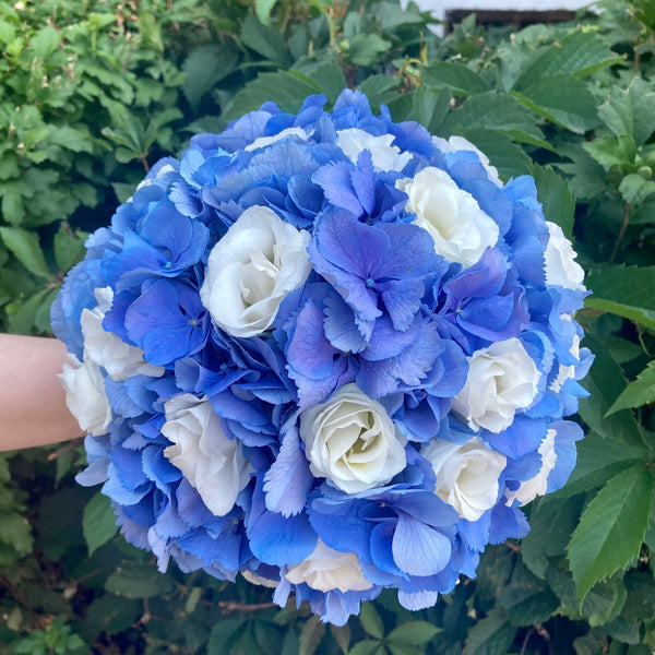 Blue hydrangea and lisianthus wedding bouquet