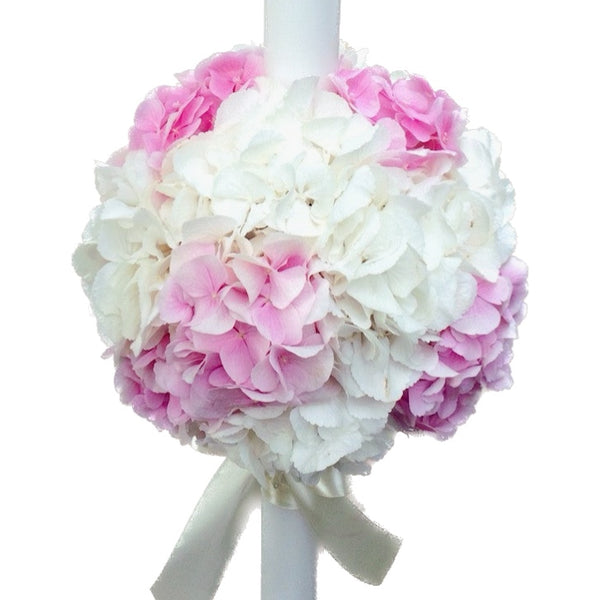 Baptism candle made of white and pink hydrangeas