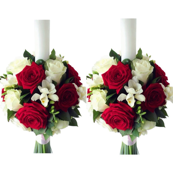 Wedding candles made of white roses, red roses and white freesias