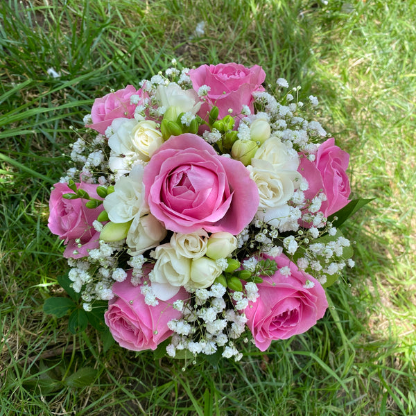 Bridal bouquet of pink roses and freesias