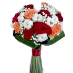 Baptism candle, coral roses and cotton