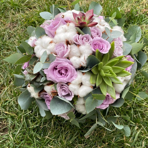 Bridal bouquet of purple and brown roses
