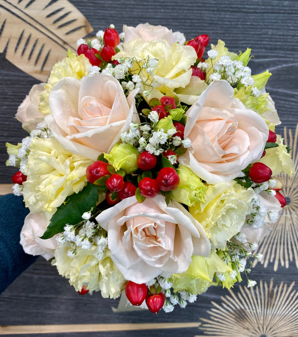 Bridal bouquet of roses, freesia and hypericum
