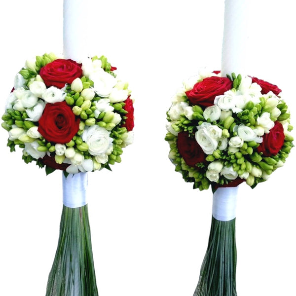 Wedding candles from red roses and white freesias