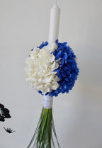 Baptism candle made of white and blue hydrangea
