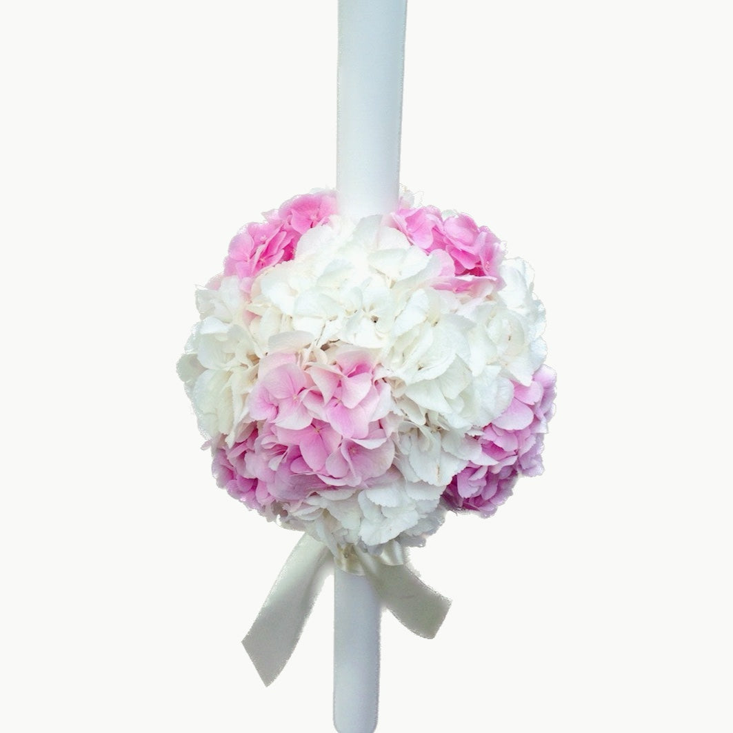 Baptism candle made of white and pink hydrangeas