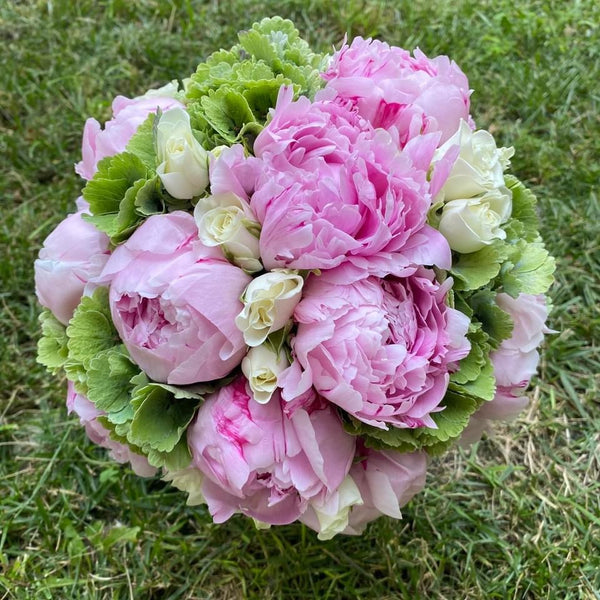 Bridal bouquet of peonies and green hydrangea