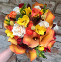 Colorful wedding bouquet with roses, cale, miniroses and hypericum