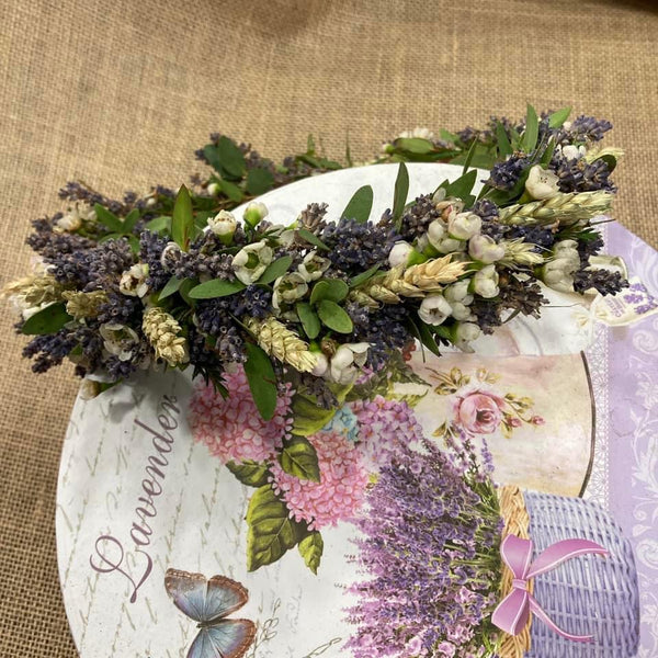 Crown of natural limonium flowers and the bride's flower