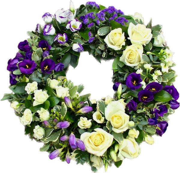 Funeral wreath with lisianthus, roses, freesias, limonium and mini roses