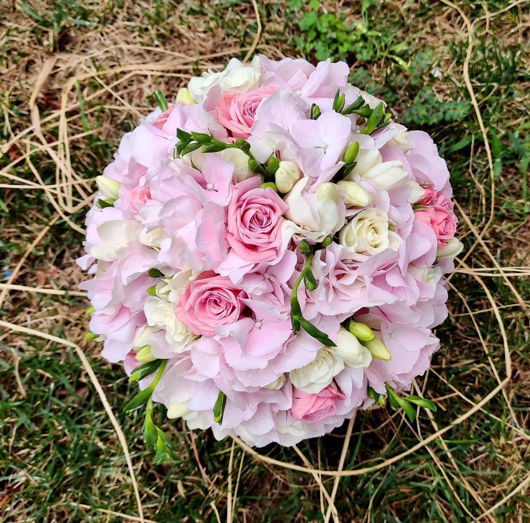 Pink hydrangea and freesia bridal bouquet