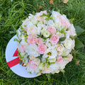 Colorful bridal bouquet of roses, freesias and lisianthus