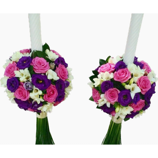 Wedding candles with aqua roses, purple lisianthus and white freesias