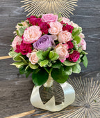 Wedding bouquet of cream roses and red mini roses