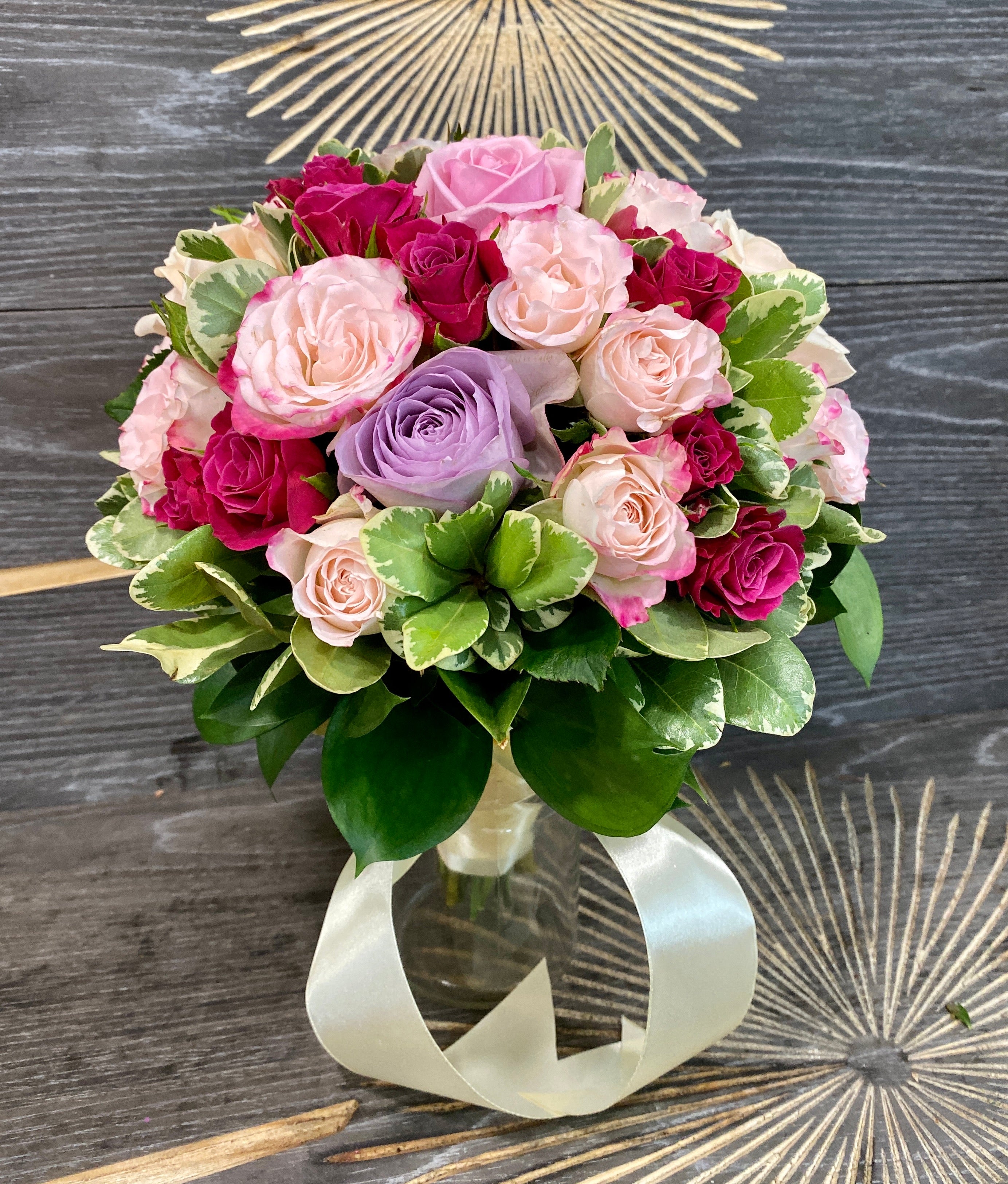 Wedding bouquet of cream roses and red mini roses