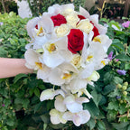 Flowing bridal bouquet with roses and phalaenopsis orchids