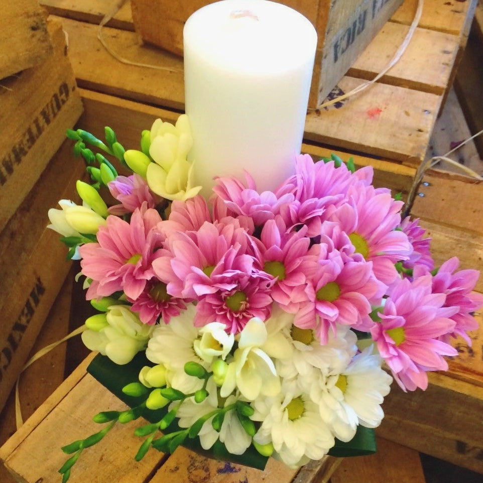 Small baptism candle with freesias and daisies