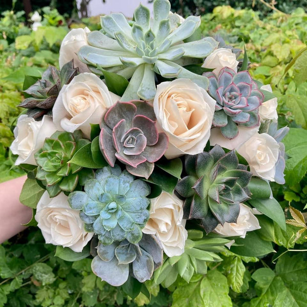 Bridal bouquet of roses and succulent plants