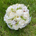 Bridal bouquet of peonies and cotton