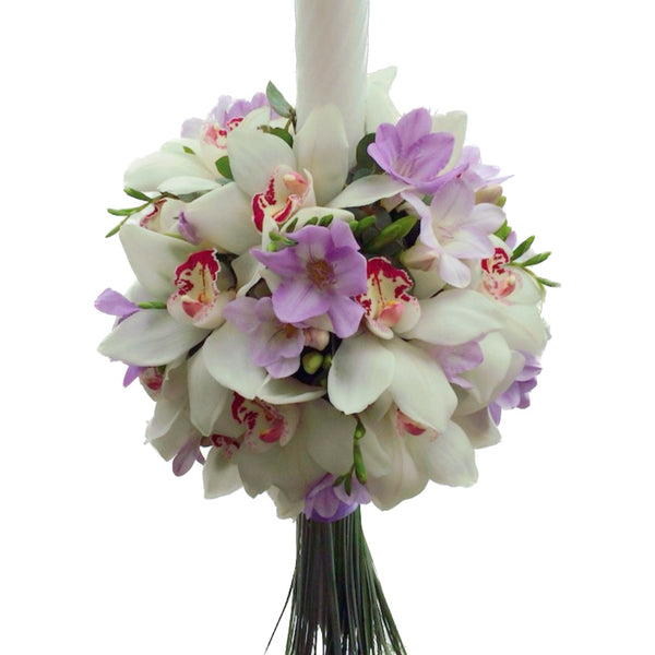 Baptism candle with white cymbidium orchids and purple freesias