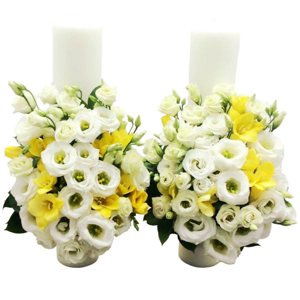 Short wedding candles, yellow freesias and lisianthus