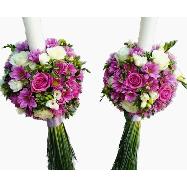 Wedding candles with pink roses, white freesias and lilac chrysanthemums