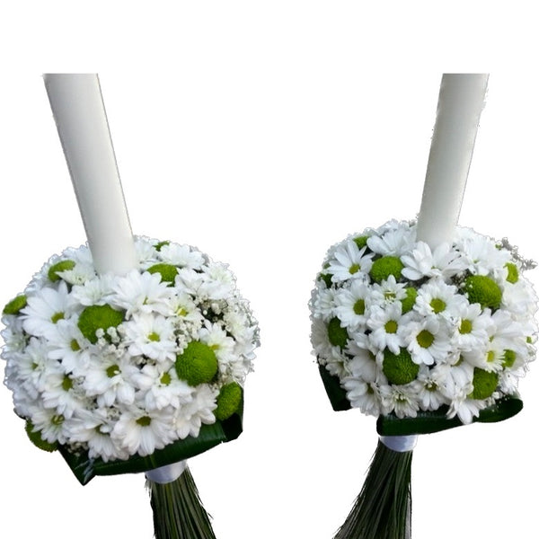 Wedding candles made of white chrysanthemums, santini and the bride's flower