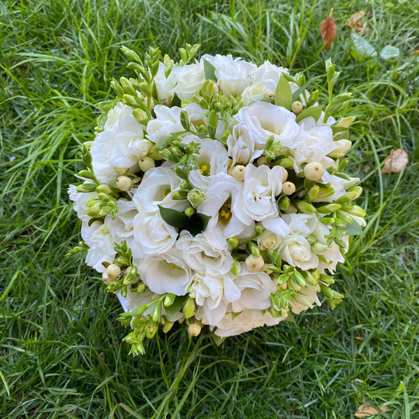 Freesia and hypericum wedding bouquet