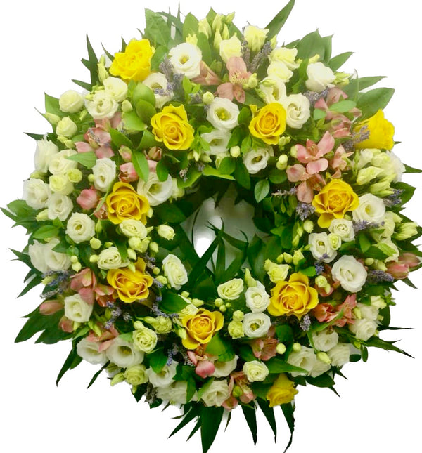 Round funeral wreath yellow roses