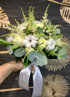 Bridal bouquet of lilac, astilbe and brunia roses