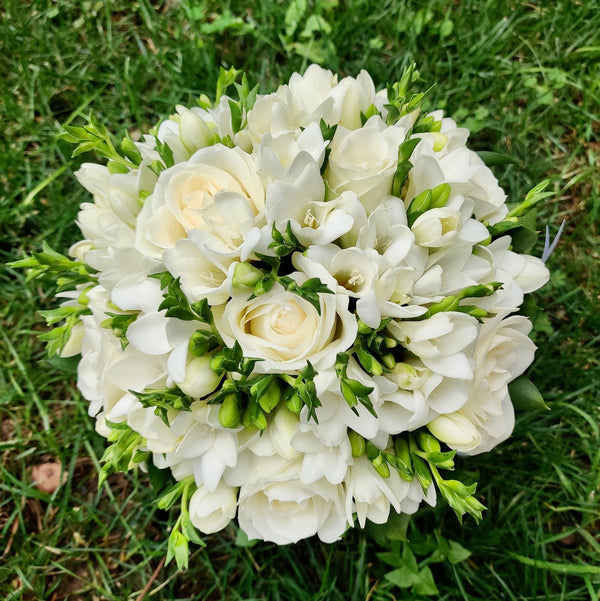 Bridal bouquet of freesias and white roses