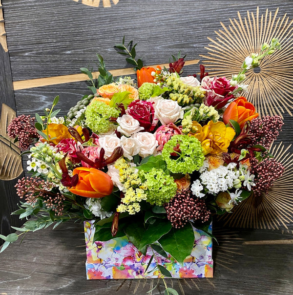 Box with spring flowers - tulips and viburnum