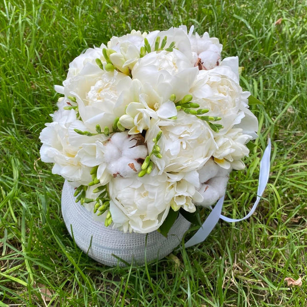 Bridal bouquet of peonies and cotton