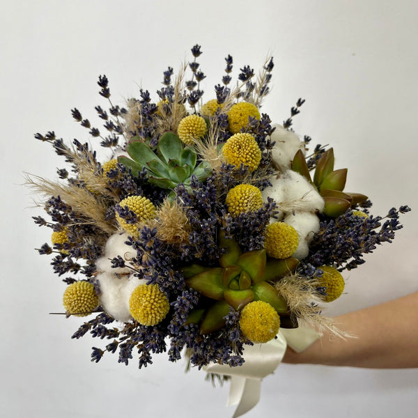 Wedding bouquet with succulent plants, lavender, cotton, pampas and craspedia