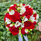 Wedding bouquet of roses, mini roses and freesias
