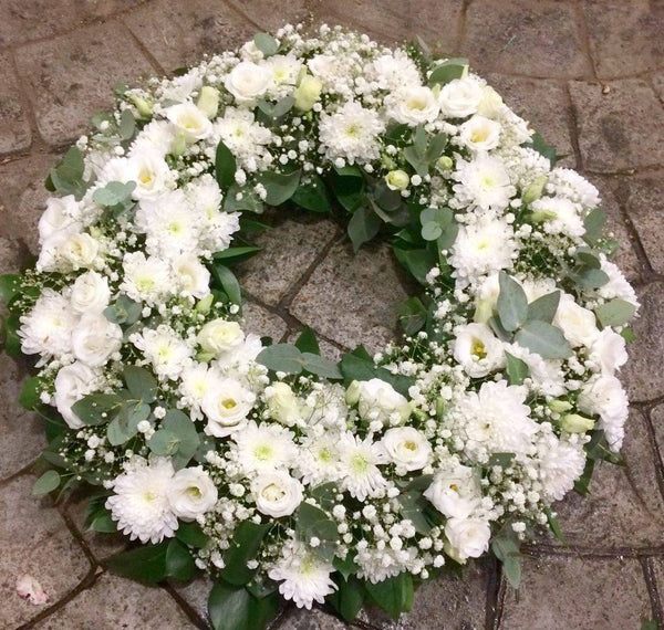 Comanda online Coroana funerara rotunda flori albe, la pret special!