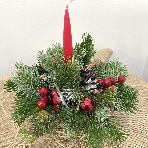 Christmas arrangement with candle and natural Christmas tree