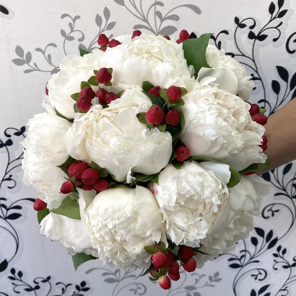 Bridal bouquet of peonies and hypericum