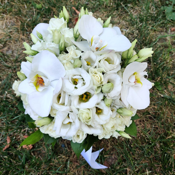 Wedding bouquet of mini white roses and orchids