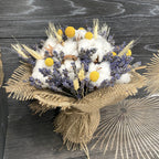 Rustic wedding bouquet of ears of wheat, cotton and craspedia