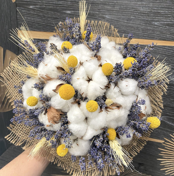 Rustic wedding bouquet of ears of wheat, cotton and craspedia