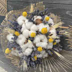 Rustic wedding bouquet of ears of wheat, cotton and craspedia