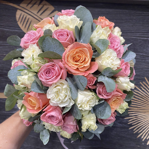 Wedding bouquet with roses and eucalyptus