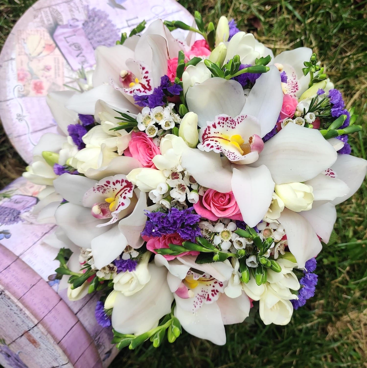 Bridal bouquet of cymbidium orchids and mini roses