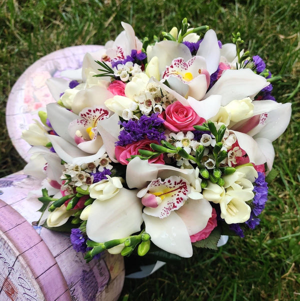 Bridal bouquet of cymbidium orchids and mini roses