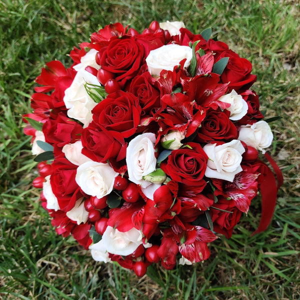 Red bridal bouquet with mini roses and hypericum