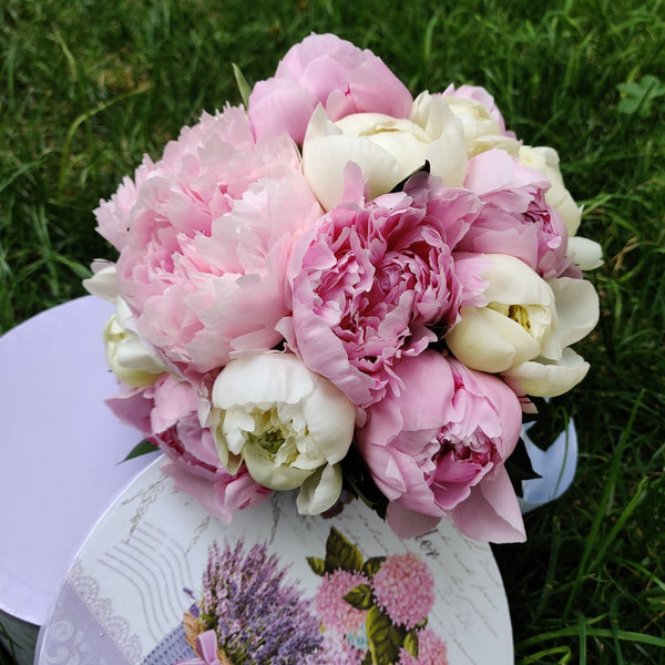 Bridal bouquet of white and pink peonies